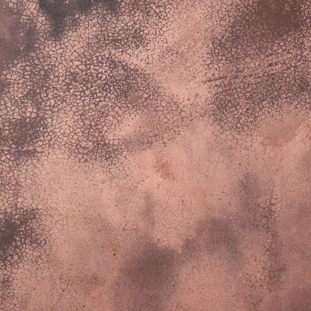 A close-up of KAVA. An interior surface made by pressing coffee waste into a substrate. In this image, it also includes red copper.